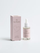 Microbiome Serum von Hey Beauty, Glasflasche mit Pipette und Verpackung